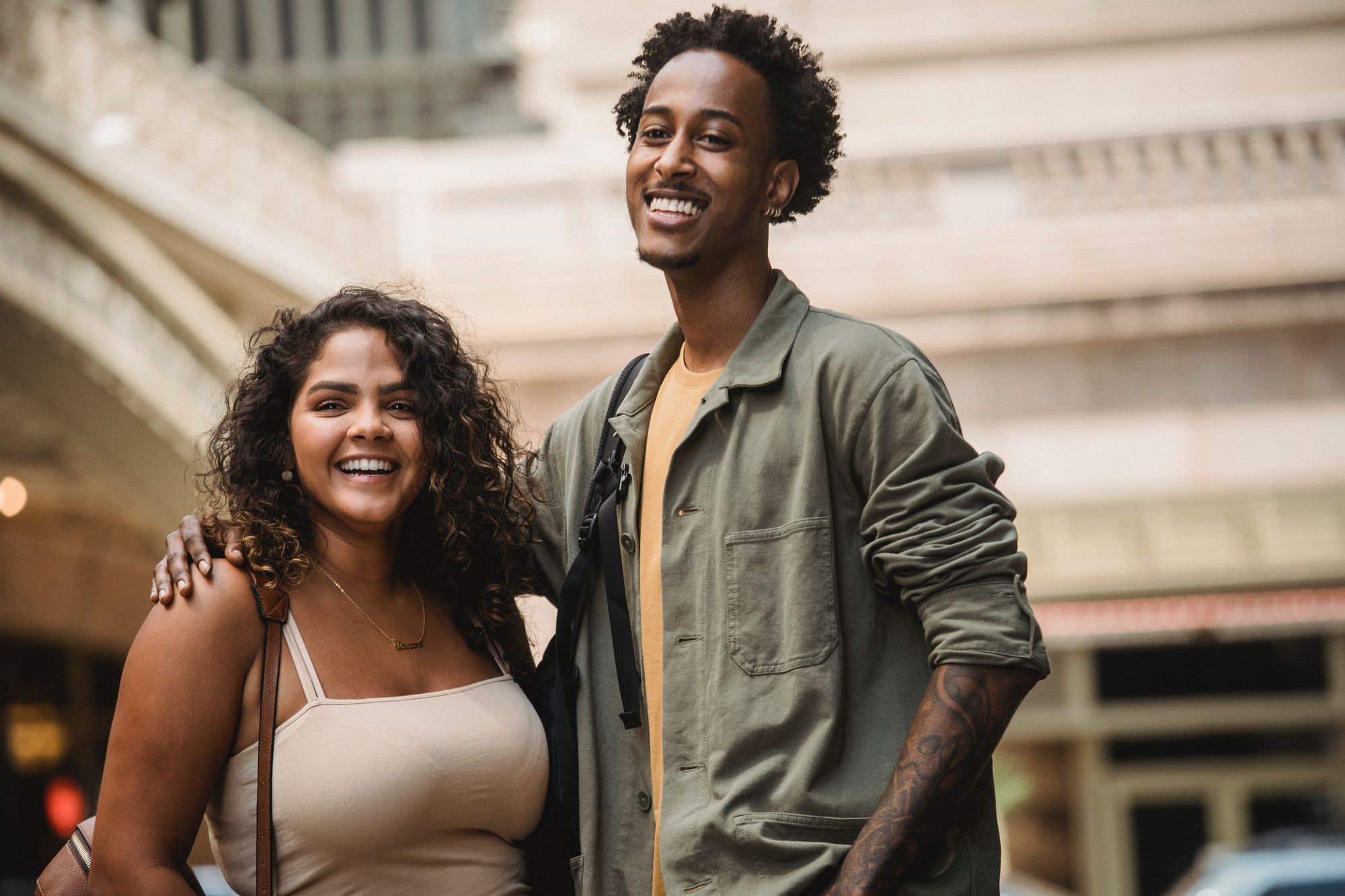 A couple standing in front of Grand Central Terminal